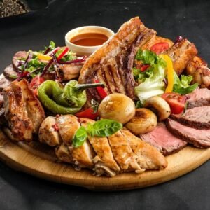 Grilled,Meat,Assortment,With,Pepper,,Grilled,Potato,,Tomato,And,Greens